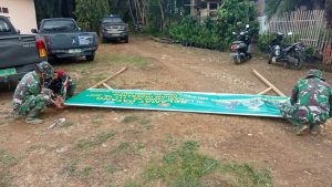 Sambut Tim Wasev TMMD, Satgas Siapkan Sepanduk “Selamat Datang”