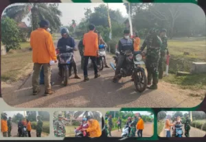 Semangat Kemerdekaan: Satgas TMMD ke-121 dan Mahasiswa Unja Bagikan Bendera Merah Putih di Desa Sukamaju