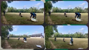 Satgas TMMD Gotong Royong Membersihkan Lapangan Sepak Bola Bajaw