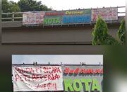 Spanduk Kritik PETI Kembali Terpasang di Jembatan Layang Bangko, Sindir Bupati dan Aparat Penegak Hukum
