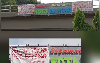 Spanduk Kritik PETI Kembali Terpasang di Jembatan Layang Bangko, Sindir Bupati dan Aparat Penegak Hukum