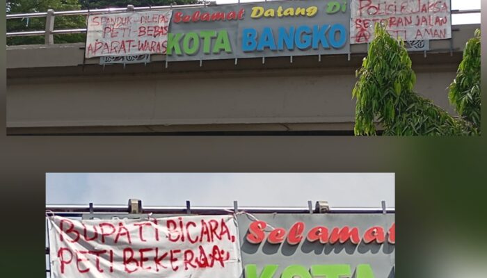 Spanduk Kritik PETI Kembali Terpasang di Jembatan Layang Bangko, Sindir Bupati dan Aparat Penegak Hukum